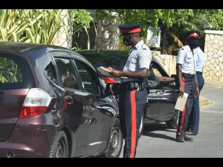 
Police officers on duty in the resort town of Falmouth, Trelawny