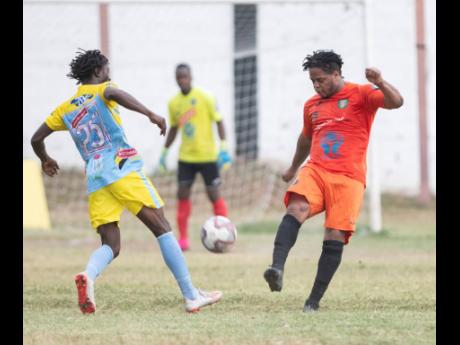 Waterhouse FC’s Rafiek Thomas (left) challenges Tivoli Gardens’ Ranike Anderson for the ball during a Jamaica Premier League game at the Edward Seaga Sports Complex, on Sunday, February 23, 2020.