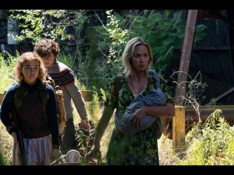 Emily Blunt (right), Millicent Simmonds and Noah Jupe star in ‘A Quiet Place 11’.