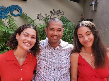 
Mikael Phillips and his daughters, Isabel (left) and Gabriela.