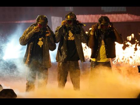 From left: Takeoff, Quavo and Offset, of Migos, perform.