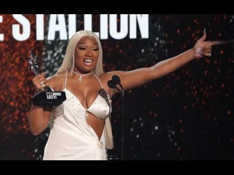 Megan Thee Stallion accepts the award for Best Female Hip Hop Artiste award at the BET Awards on Sunday.