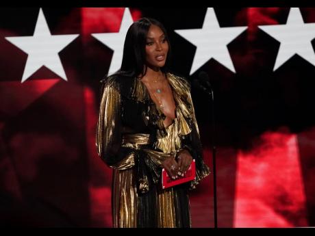 Naomi Campbell presents the Best Male Hip Hop Artist Award. 