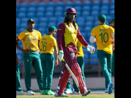 West Indies batsman Chris Gayle walks off after being dismissed for eight in the second Twenty20 International against South Africa in St George’s, Grenada, yesterday.
