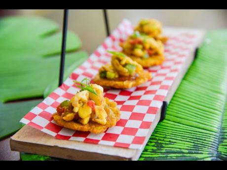 Ackee and mango chutney perfectly placed on a bed of tostones. That’s the magic of Ackee Backee. 