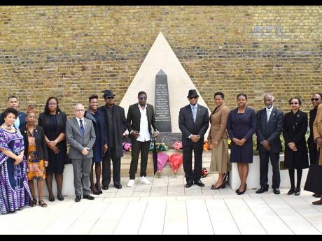 TOP: CARICOM Caucus Heads of Mission at the African and Caribbean War Memorial at Windrush Square, Brixton, south London, after the floral tribute ceremony to mark Windrush Day.