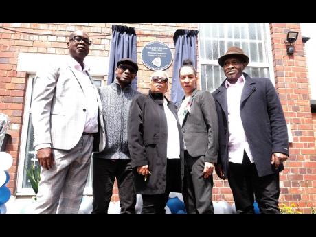 Windrush campaigner Patrick Vernon (left) joins Michael Braithwaite, Glenda Caesar, Natalie Barnes (daughter of Paulette Wilson) and Anthony Bryan, at the unveiling of the memorial plaque for late campaigne, Paulette Wilson in Wolverhampton. 