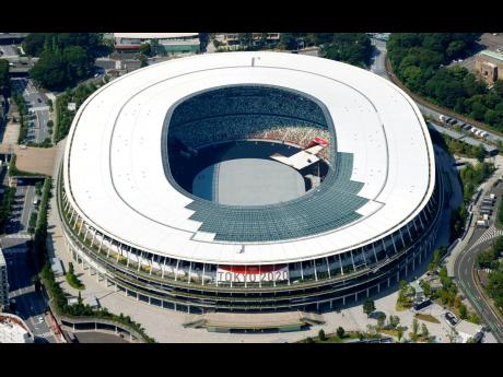 This aerial photo shows the National Stadium in Tokyo, Japan Monday, June 21, 2021. Fans will be banned from Tokyo-area stadiums and arenas when the Olympics begin in two weeks, the city’s governor said Thursday after meeting with organisers of the pande