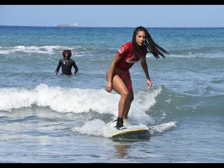 With her surf trainer Frogboss keeping a watchful eye in the background, Naomi Cowan caught a wave. It’s a feat, she says, made her feel accomplished and free. With her surf trainer Frogboss keeping a watchful eye in the background, Naomi Cowan caught a 
