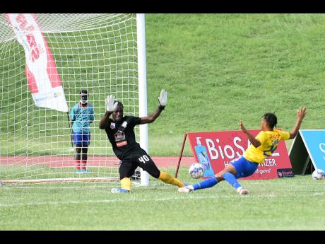 
Mount Pleasant goalkeeper David Swaby is beaten by a redirected tap in from Harbour View’s Oquassa Chong (right) during their Jamaica Premier league game at Stadium East in St Andrew yesterday.