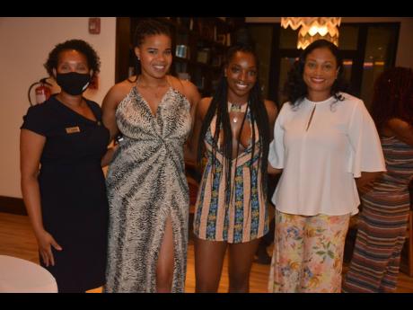 Shaunise Williams (second right), process engineer at Ford, and real estate agent Trisha Jackson (second left) share lens time with Odette Dyer (right), Jamaica Tourist Board regional manager, and Tanesha Clarke, marketing and sales director, Ocean Coral S