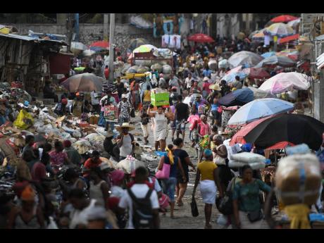 The Petion-Ville market in Port-au-Prince, Haiti, teems with shoppers and vendors on Sunday. Jamaican authorities are on the lookout for a wave of Haitian boat people since the assassination of Haitian President Jovenel Moise.