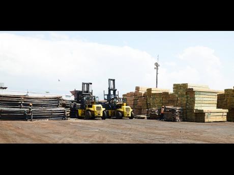 Construction material is seen on the wharf in this 2019 photo. Lumber and steel are said to be among the materials experiencing rising cost, but the rising prices have not deterred construction projects. 