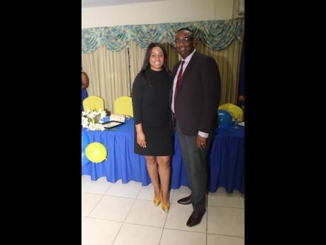 Immediate past president of the Rotary Club of Mandeville, Dr Garth Anderson (right), and his wife, Tracey Ann, were a hot number for the celebration.