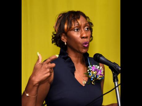 Diahann Gordon Harrison, children’s advocate, speaks at the Kiwanis Club of New Kingston prayer breakfast and awards ceremony at the Police Officers’ Club in Kingston last Saturday.