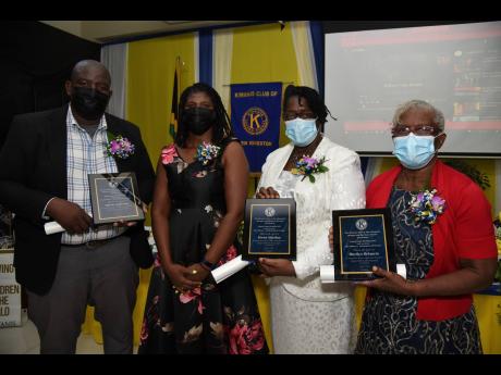 Suzilee McLean-Chambers (second left) president, Kiwanis Club of New Kingston, with awardees from the early- childhood education sector at the club’s prayer breakfast on Saturday morning. From left are Meikle Anderson, who collected the award on behalf o