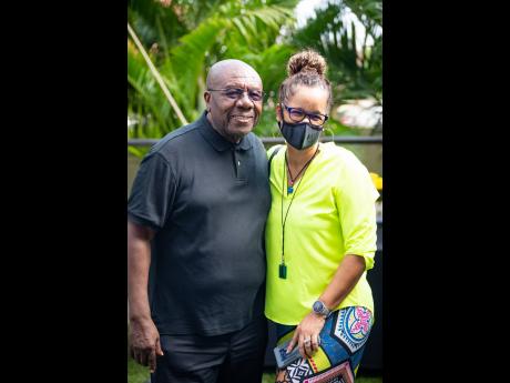 Above: Veteran Jamaican comedian and radio host on The Bridge, Oliver Samuels, is joined by Wendy Duncan for a friendly photo op following his lively on-air interview with Nikki Z. 
