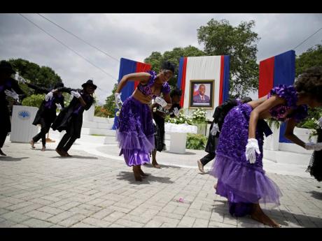 Artists perform at the National Pantheon Museum during a memorial service for late Haitian President Jovenel Moise in Port-au-Prince, Haiti yesterday. Moise was assassinated on July 7 at his home.