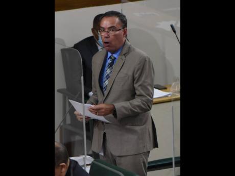 Minister of Science and Technology Daryl Vaz pilots a resolution in Parliament on Tuesday.