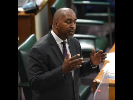 Opposition Spokesman on Finance Julian Robinson cautions the Government in Parliament on Tuesday.