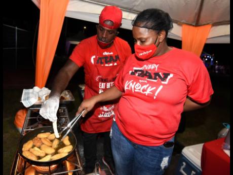 Husband-and-wife duo Desrick Hamilton (left) and Tameka Forbes-Hamilton are seen getting the festivals ready for foodies to savour. 
