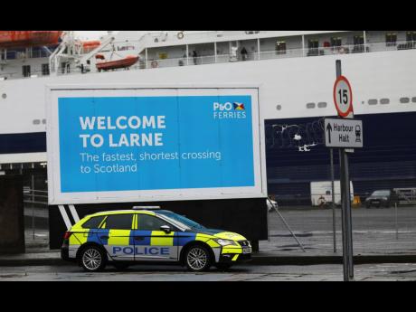 AP 
Police patrol the port of Larne, Northern Ireland, in February. 