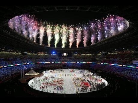 Fireworks are set off on the roof of the Olympic Stadium after the parade of teams during the opening ceremony of the Olympic Games in Tokyo, Japan on Friday morning.