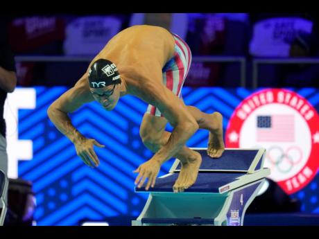 In this June 19, 2021, file photo, Michael Andrew participates in the men’s 50 freestyle during wave 2 of the United States. Olympic Swim Trials in Omaha, Nebraska. A debate is fomenting between former gold medallist Maya DiRado and some American swimmer