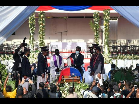 The funeral for slain Haitian President Jovenel Moise at his family home in Cap-Haitien, Haiti, early Friday, July 23, 2021.