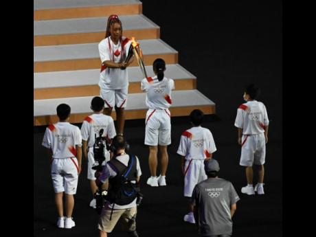 The torch relay at the opening ceremony at the Tokyo 2021 Olympics held at the Olympic Stadium in Tokyo, Japan on Friday, July 23, 2021.