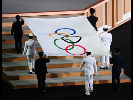 The Olympic flag raising ceremony during the opening ceremony for the Tokyo 2021 Olympics held at the Olympic Stadium in Tokyo, Japan on Friday, July 23, 2021.