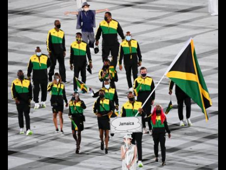 Sprinter Shelly-Ann Fraser-Pryce and boxer Ricardo ‘Big 12’ Brown led Team Jamaica as its flag-bearers at the opening ceremony of the Olympic Games at the National Stadium in Tokyo, Japan.