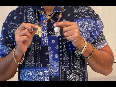Both the Ethiopian cross (left) and crystal hold sentimental value for Sean Paul.