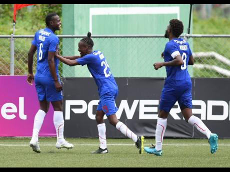 Portmore United’s Chavany Willis (centre) celebrates his goal with teammates Taja Brown (left) and Ricardo Morris during their 3-0 win over Humble Lion in the Jamaica Premier League at the UWI/JFF Captain Horace Burrell Centre of Excellence yesterday.