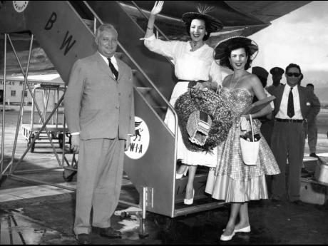 Reluctant goodbyes were the order of the day when film stars Linda Darnell and Ann Miller said their au revoirs at Palisadoes Airport November 14 1955. Both girls were wearing typical Jamaican hats.