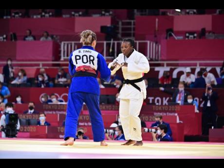 National judoka Ebony Drysdale Daley (right) faces off against Portugal's Barbara Timo in Women's 70kg Judo Round of 32 Elimination action at the Olympic Games, at the Nippon Budokan field of play in Tokyo, Japan on Tuesday night, Jamaica time.