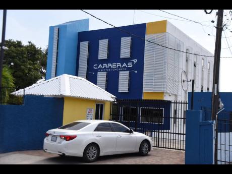 The Carreras head office located at Ripon Road in St Andrew. The cigarette distributor said that proposed legislation would imperil the offer of scholarships to needy students.