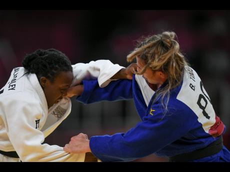 Jamaica’s Ebony Drysdale-Daley competes against  Portugal’s Barbara Timo in the women’s -70kg elimination round of judo at the Nippon Budokan during the Tokyo 2020 Olympics on Wednesday. Drysdale Daley, who lost to Timo, is Jamaica’s first Olympian