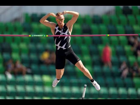 In this June 21, 2021 file photo, Sam Kendricks competes during the finals of the men’s pole vault at the United States Olympic track and field Trials in Eugene, Oregon. 