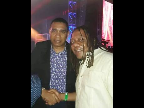 Sean ‘Contractor’ Edwards (right) and Prime Minister Andrew Holness at the Air Supply concert at Couples San Souci in May 2019.