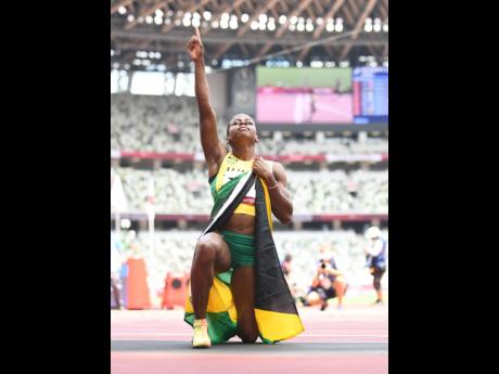 Megan Tapper celebrates after claiming Jamaica’s first ever medal, a bronze, in the Women’s 100m Hurdles event at the Tokyo Olympic Games in Tokyo, Japan, on Monday.