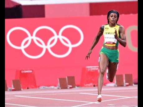 Elaine Thompson-Herah competing in the 200m semi-finals at the Tokyo 2020 Olympic Games on Monday. She could become the first woman to claim consecutive double sprint titles in Olympic history.