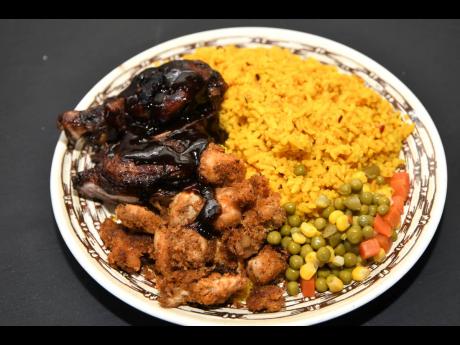 Chef Desouza dished out a mouth-watering serving of Spanish rice and mixed vegetables, with jerked chicken and popcorn chicken, topped with his signature Guinness hot sauce.