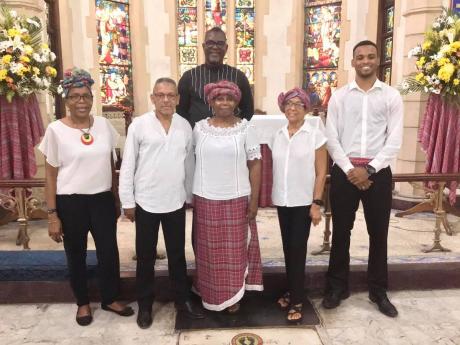 The St Andrew Parish Church choir pose for a photograph on Emancipation Day with music director Audley Davidson (back row). 