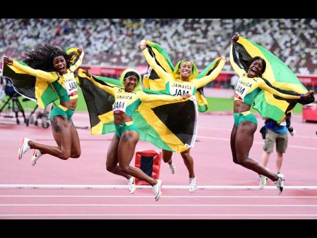 Jamaica’s 4x100m women's relay team in joyous celebration at the Toyko Olympic Stadium in Japan. The quartet comprising (from left) Elaine Thompson-Herah; Shelly-Ann Fraser-Pryce; Brianna Williams and Shericka Jackson won the event in a national record o