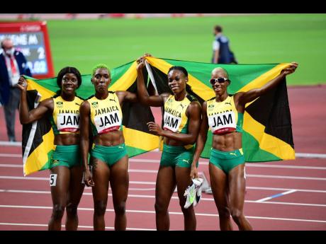 Jamaica's Women's 4x400m relay team of (from left) Shericka Jackson, Janieve Russell, Roneisha McGregor, and Candice McLeod celebrate their bronze medal earned in the Olympic Games final in Tokyo, Japan on Saturday.