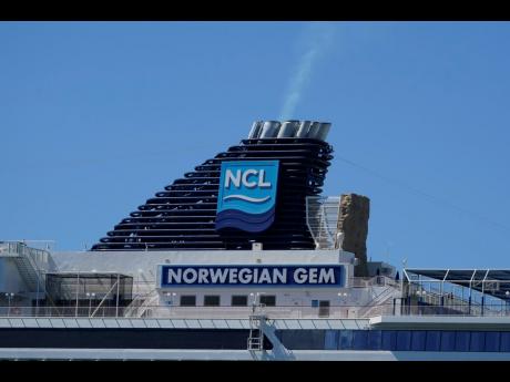 The smokestack of the ‘Norwegian Gem’ cruise ship is shown as it is docked on Monday, August 9,  at Port Miami.