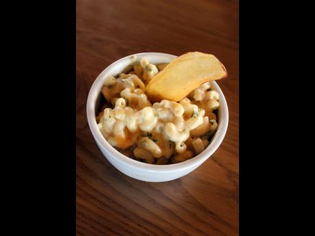 Macaroni and cheese is a tasty side dish for meat smoked or grilled over an open flame.