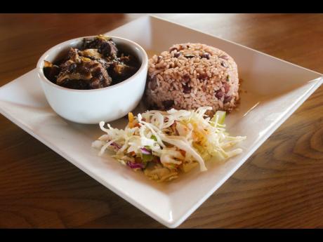 Not adventurous? This local entrée of oxtail, braised with beans, served with traditional rice and peas will still send your taste buds around the globe and back.