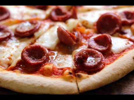 Take an up-close look at the pepperoni pizza, with thick slices of meat and extra cheese. It’s guaranteed to leave mouths watering.
